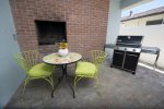 The patio area has a nice seating area to chat and a high end Weber BBQ.